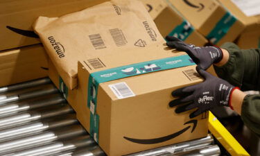 An employee handles packages at the Amazon's center of Bretigny-sur-Orge