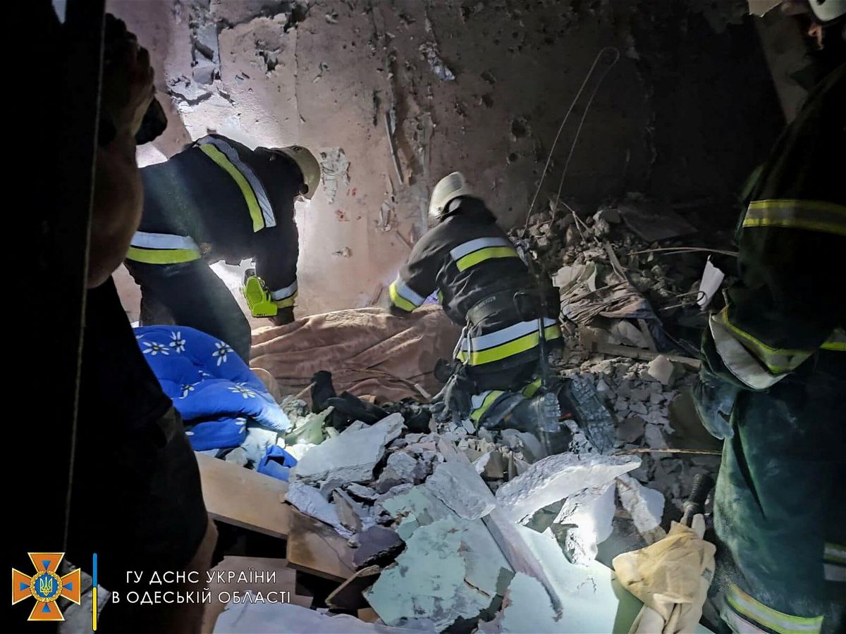 <i>State Emergency Services of Ukraine/Handout/Reuters</i><br/>Rescue workers at the scene of the missile strike