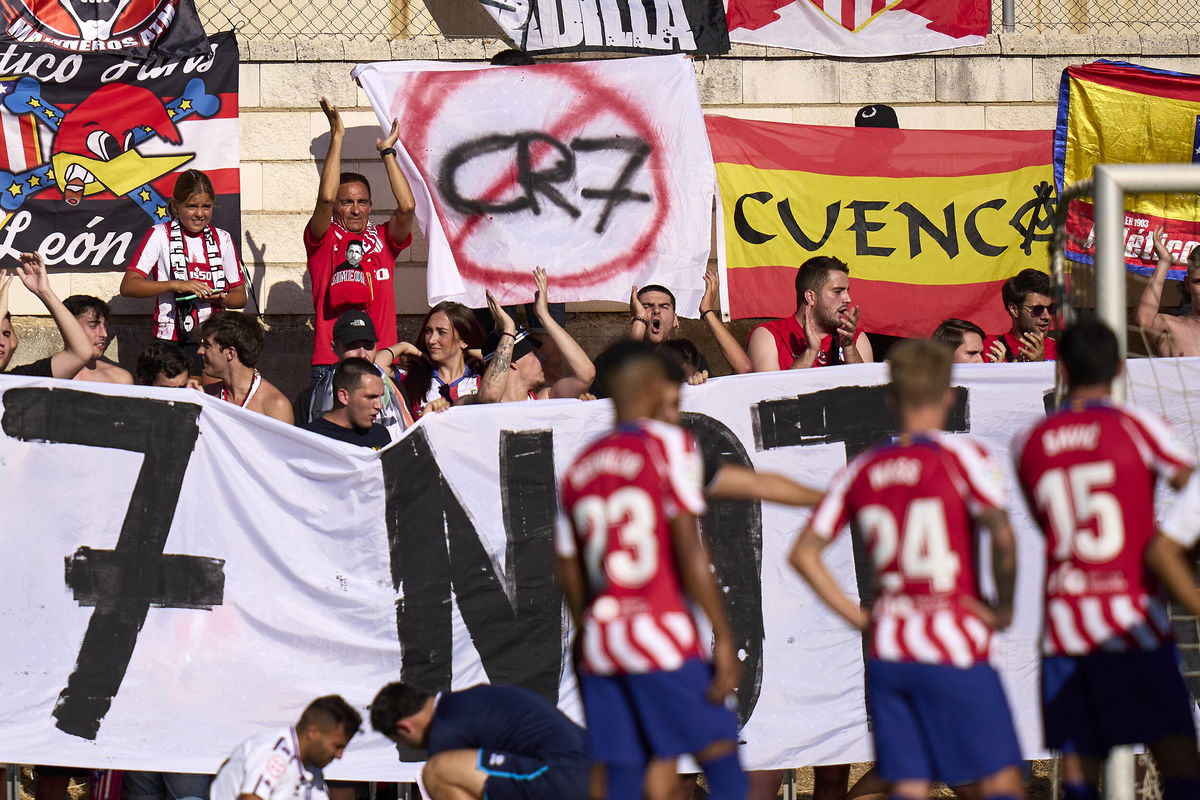 <i>Diego Souto/Quality Sport Images/Getty Images</i><br/>Atlético Madrid fans display a sign against Cristiano Ronaldo joining the club.