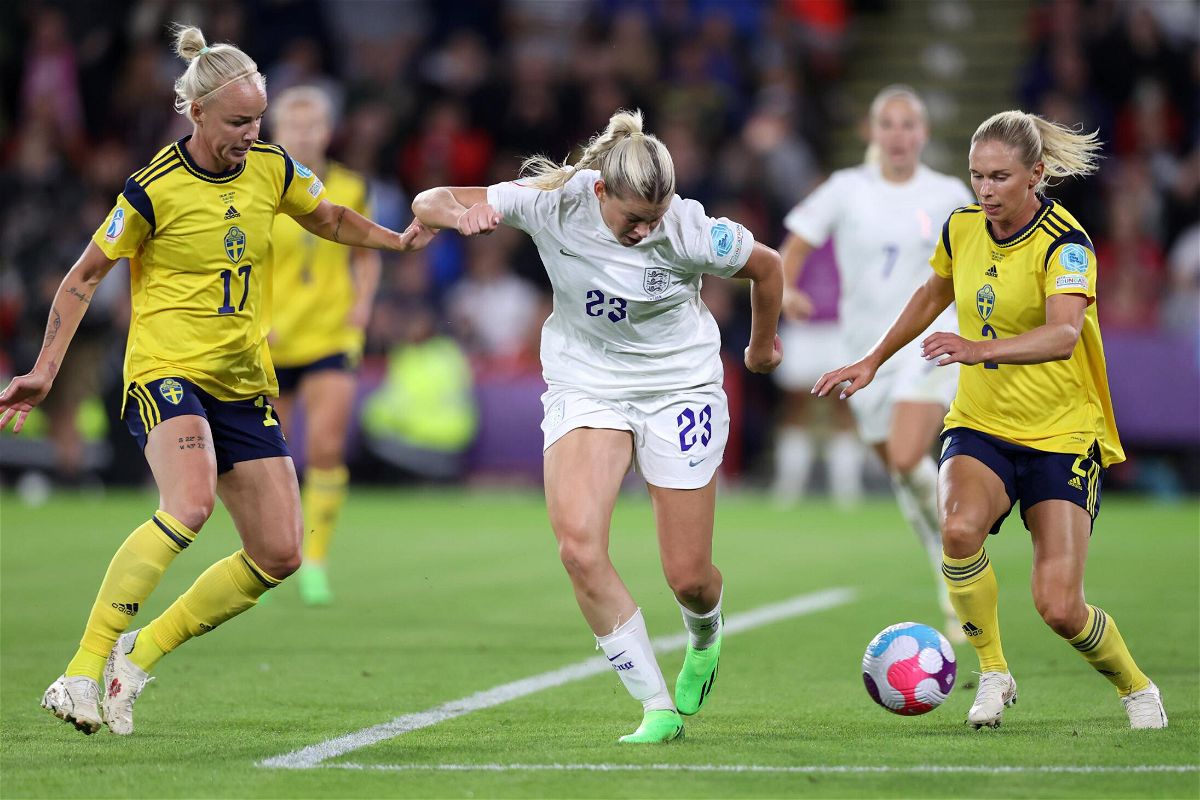 <i>Naomi Baker/Getty Images Europe/Getty Images</i><br/>Alessia Russo scoring against Sweden.