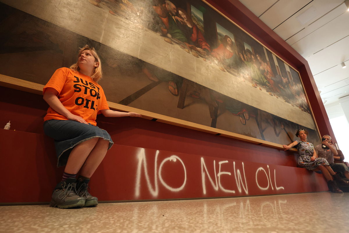 <i>James Manning/PA Images/Getty Images</i><br/>Climate protestors glued themselves to a copy of the famous Leonardo da Vinci painting.