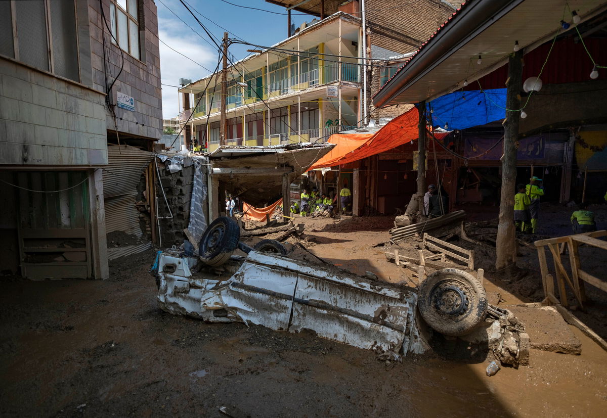 <i>Morteza Nikoubazl/NurPhoto/Getty Images</i><br/>A vehicle damaged in flash flooding in the village of Imamzadeh Davood in northwestern Tehran