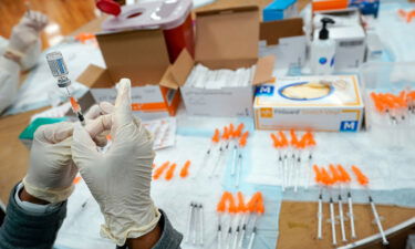 A nurse preps a syringe at a pop-up Covid-19 vaccination site in the New York borough of Staten Island in April 2021. Covid-19 cases are increasing across the United States once again.