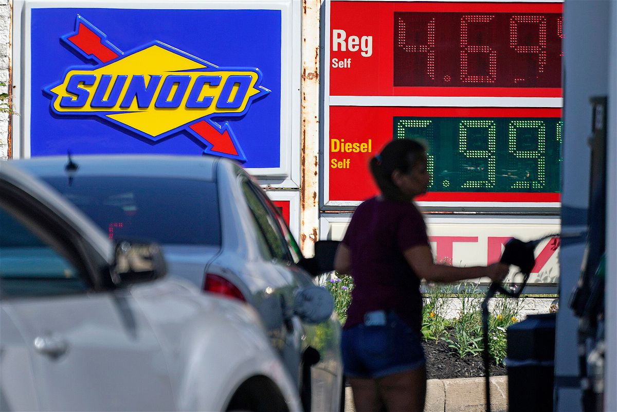 <i>Gene J. Puskar/AP</i><br/>Economists polled by Refinitiv are forecasting that prices shot up 8.8% in the 12 months to June as energy costs leaped and pictured a woman pumps gas at a Sunoco mini-mart in Independence