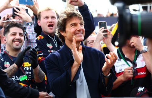 Tom Cruise applauds at the Podium celebrations during the F1 Grand Prix of Great Britain at Silverstone on Sunday in Northampton