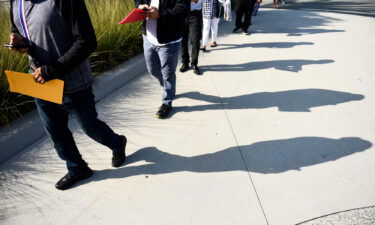 People line up to attend a job fair in September 2021