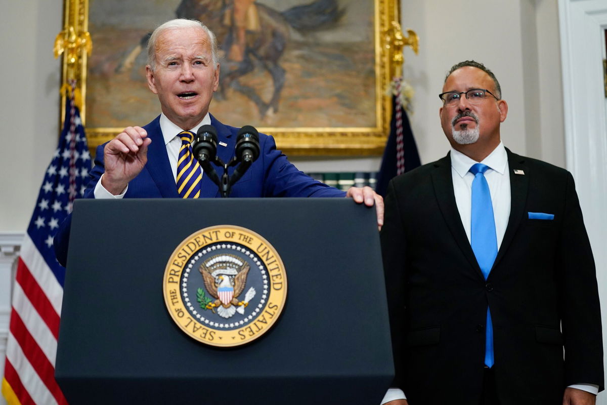 <i>Evan Vucci/AP</i><br/>President Joe Biden speaks about student loan debt forgiveness alongside Education Secretary Miguel Cardona on August 24.