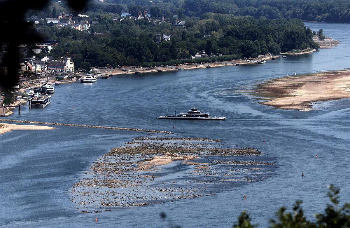 <i>Wolfgang Rattay/Reuters</i><br/>A ferry cruises past the partially dried riverbed of the Rhine river in Bingen