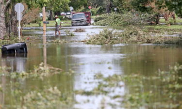 A man walks through the flooded streets in the Lakeview neighborhood of New Orleans in August 2021. Louisiana state officials have delayed flood funding to New Orleans for a second time over city officials' stance on abortion.