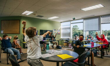 Most US public schools plan to keep masks optional for the start of classes. Children participate in a class activity at the Xavier Academy on August 23