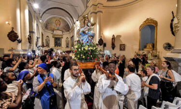 Worshippers carry the shrine of the Madonna of Trapani during the procession at the Saint-Augustin and Saint-Fidèle church in Tunisia on August 15.