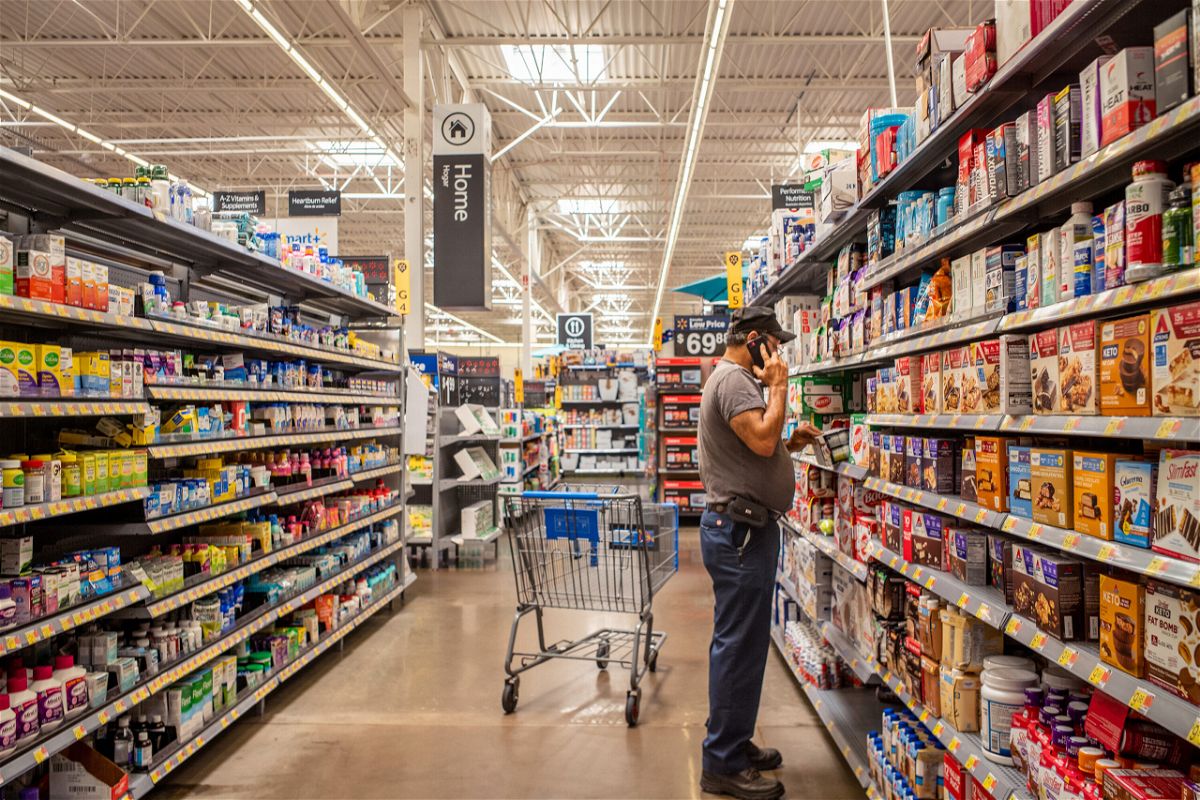 <i>Brandon Bell/Getty Images</i><br/>A customer shops for nutrition products in a Walmart Supercenter on July 8 in Houston