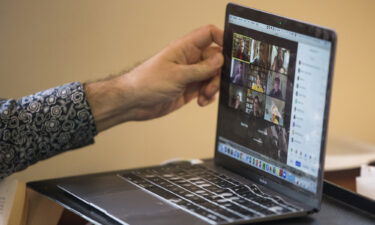 Zoom shares plunged more than 10% on August 23. A PhD candidate at Harvard tilts his screen while teaching an online class in April of 2020 in Cambridge