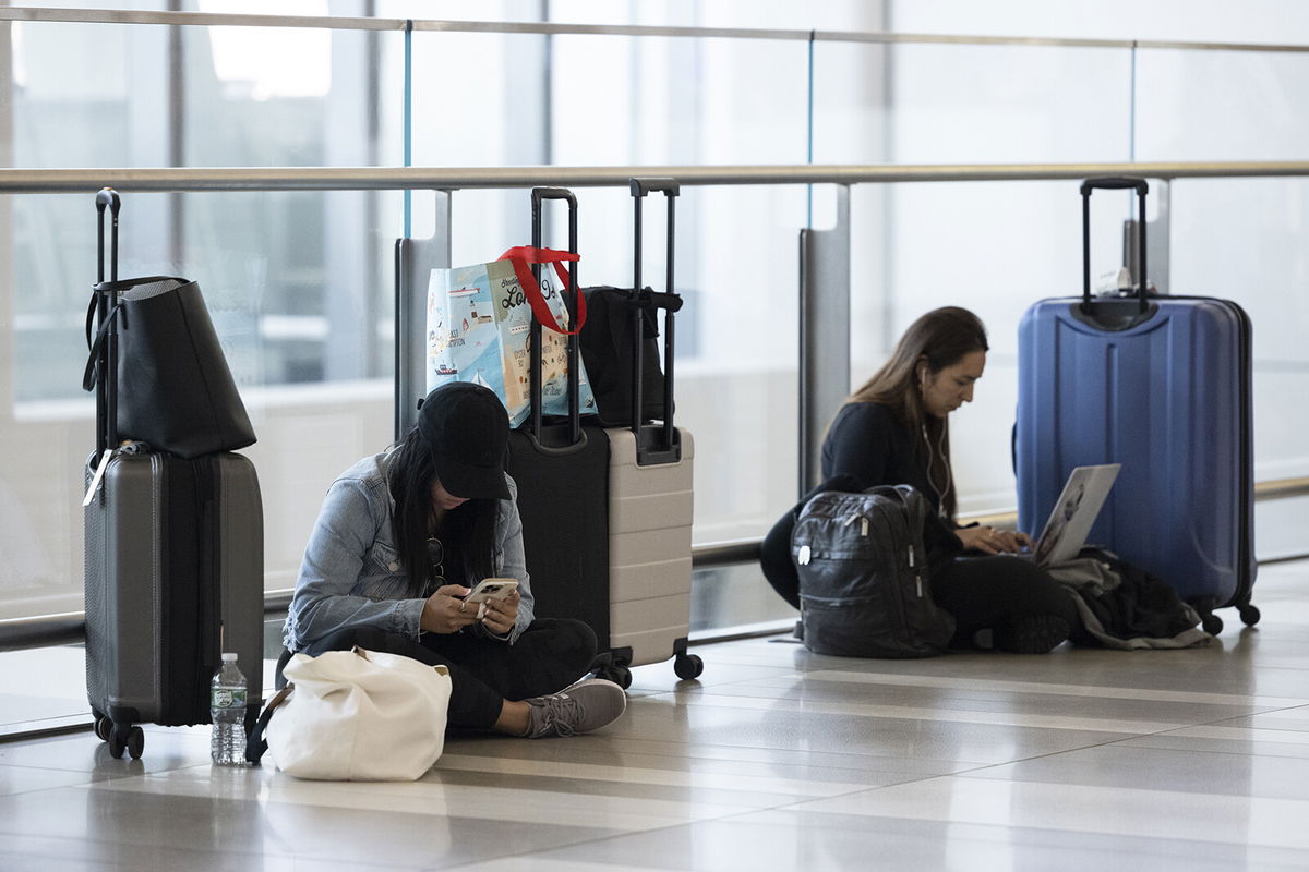 <i>Angus Mordant/Bloomberg/Getty Images</i><br/>Travelers are pictured at LaGuardia Airport (LGA) in the Queens borough of New York