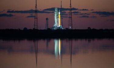 NASA's Space Launch System (SLS) rocket with the Orion spacecraft aboard are seen at sunrise atop a mobile launcher at Launch Complex 39B