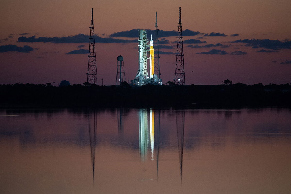 <i>Joel Kowsky/NASA</i><br/>NASA's Space Launch System (SLS) rocket with the Orion spacecraft aboard are seen at sunrise atop a mobile launcher at Launch Complex 39B