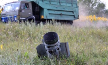A Russian missile is stuck in the ground as the harvest season is underway in the northern part of the region despite Russian shelling