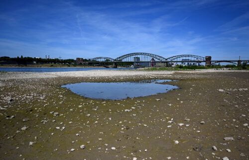 A puddle of water in the nearly dried-up river bed of the Rhine in Cologne