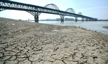 A section of a parched river bed is seen along the Yangtze River in Jiujiang in China's central Jiangxi province on August 19