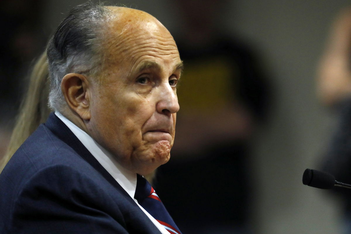 <i>Jeff Kowalsky/AFP/Getty Images</i><br/>Giuliani looks on during an appearance before the Michigan House Oversight Committee in Lansing