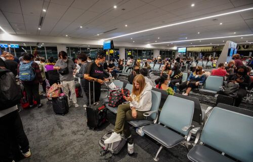 Travelers wait for their flight at Los Angeles International Airport. After two years of the pandemic