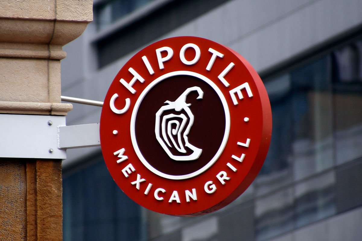 <i>Keith Srakocic/AP</i><br/>Workers at a Chipotle Mexican Grill in Lansing