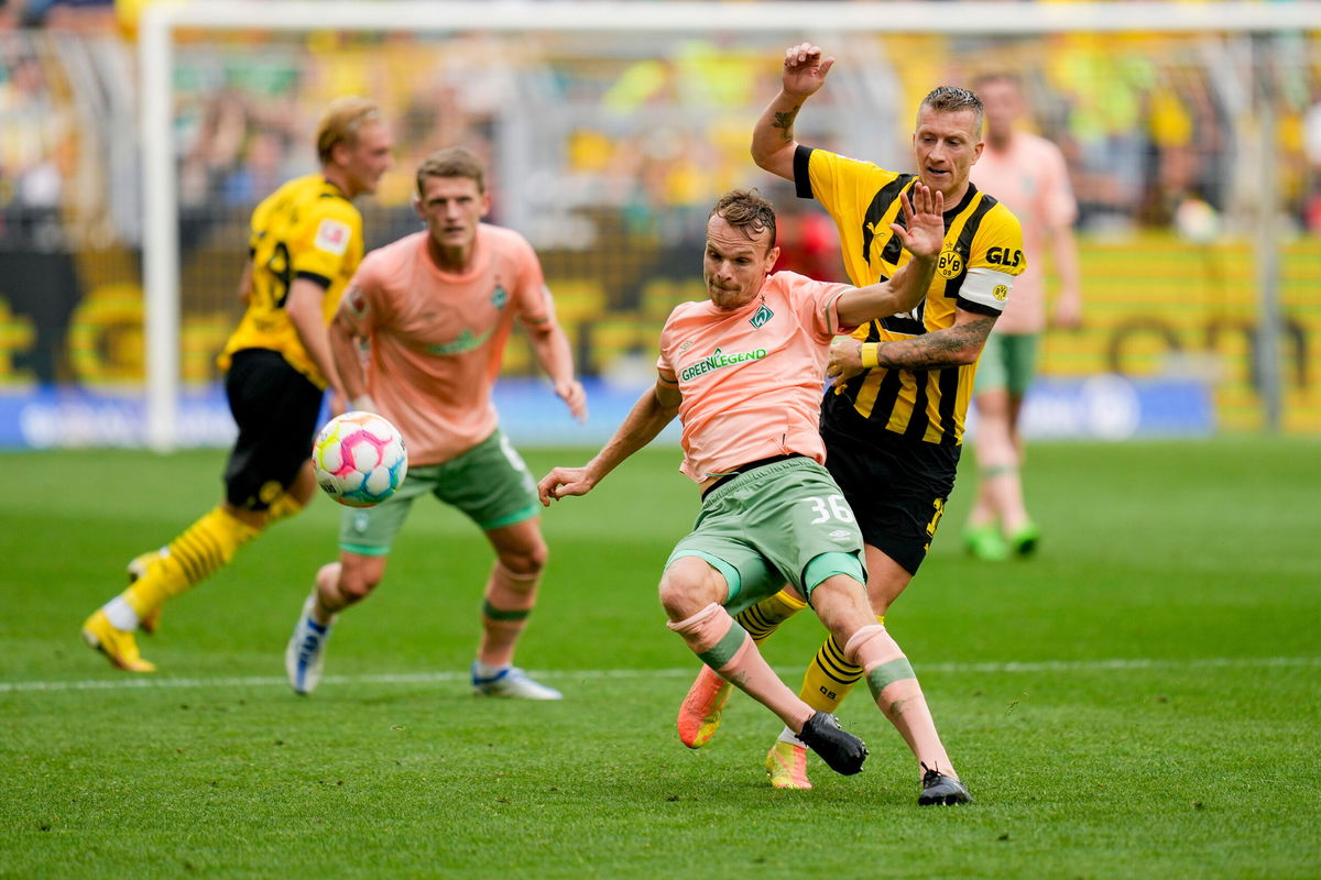 <i>Alex Gottschalk/DeFodi Images/Getty Images</i><br/>Christian Gross of Werder Bremen and Borussia Dortmund's Marco Reus in action during their Bundesliga match.