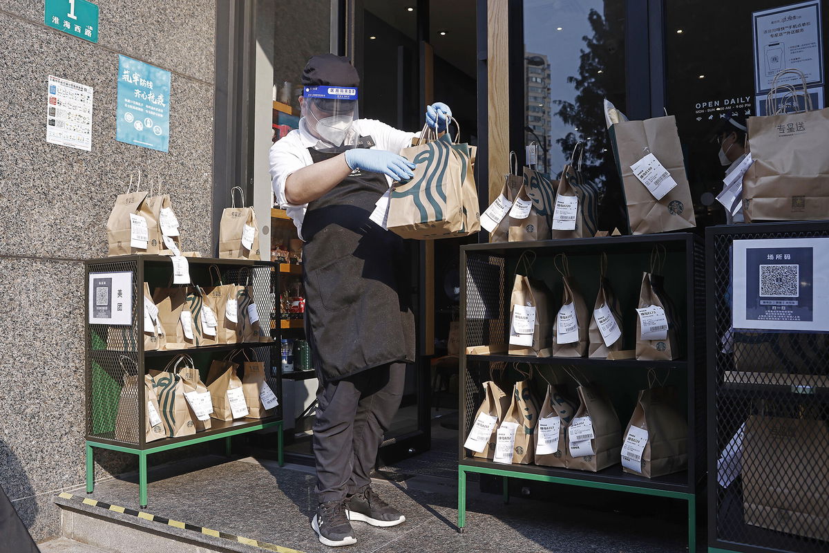 <i>Yin Liqin/China News Service/Getty Images</i><br/>Covid-19 restrictions dragged down Starbucks' sales in China.