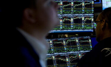 Traders work during the opening bell at the New York Stock Exchange (NYSE) on Wall Street in New York City on August 16.