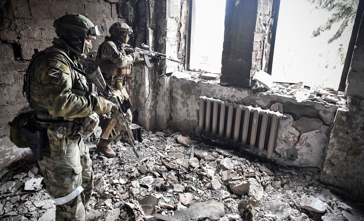 <i>Alexander Nemenov/AFP/Getty Images</i><br/>Two Russian soldiers are pictured here patrolling in the Mariupol drama theatre in Mariupol on April 12