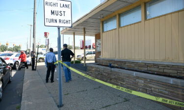 Detroit Police and investigators look over a homicide scene on Wyoming Avenue on Sunday