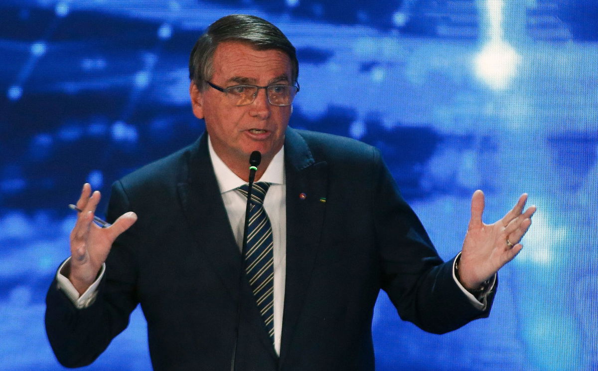 <i>Miguel Schincariol/AFP/Getty Images</i><br/>Brazilian President Jair Bolsonaro gestures during the presidential debate in Sao Paulo