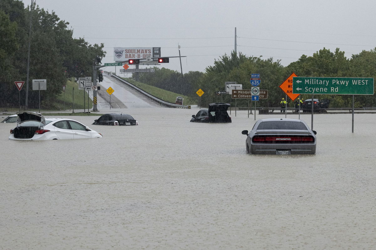 <i>Juan Figueroa/The Dallas Morning News/Associated Press</i><br/>Stalled cars sit abandoned on the flooded Interstate 635 Service Road in Mesquite