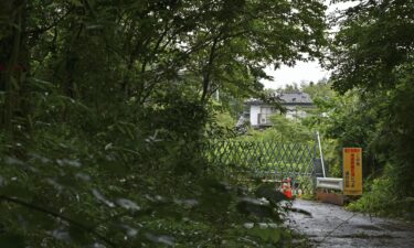 A barricade bars entry to a designated area in the Fukushima prefecture town of Futaba