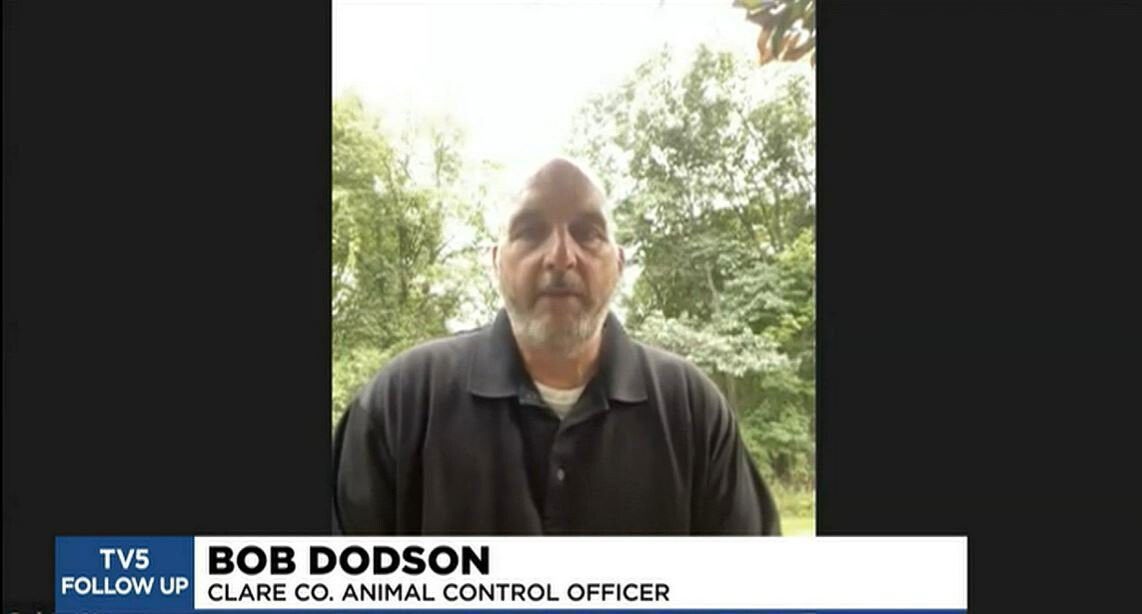 <i>WNEM</i><br/>Animal control officer Bob Dodson believes the fly-to-honey method is gaining the stranded dog's trust.