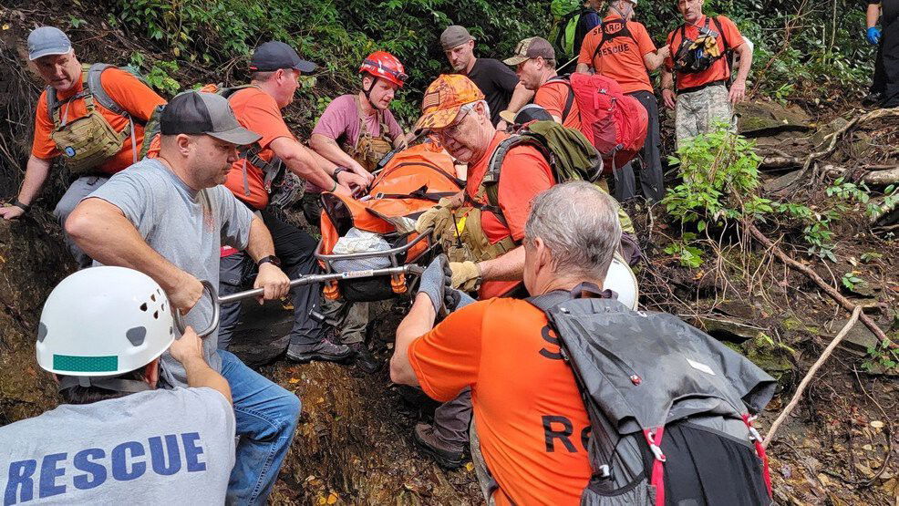 <i>Transylvania County Rescue Squad/WLOS</i><br/>Rescue squad members work to carry an injured hiker out from an area of Shining Rock Wilderness.