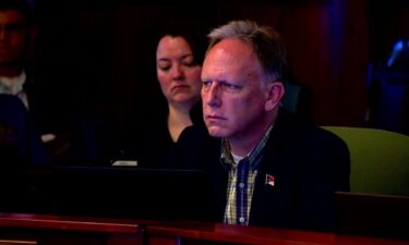 Commissioner Daniel Andreotta listens to community comments during a commissioners' meeting.