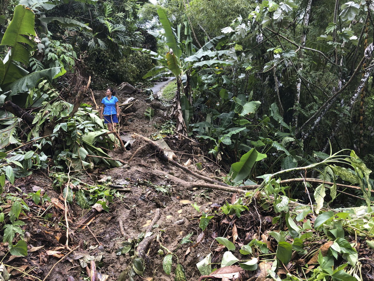 <i>Danica Coto/AP</i><br/>Nancy Galarza looks at the damage Hurricane Fiona inflicted on her rural community of San Salvador in the town of Caguas