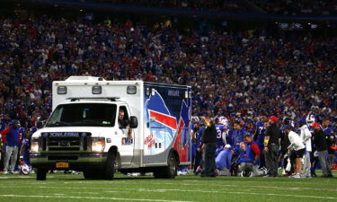 An ambulance prepares to take Dane Jackson to the hospital after he suffered an injury.