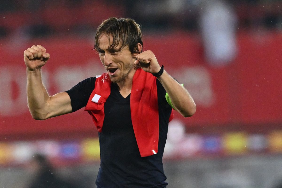 <i>JOE KLAMAR/AFP/AFP via Getty Images</i><br/>Luka Modric celebrates after securing Croatia's place in the finals.