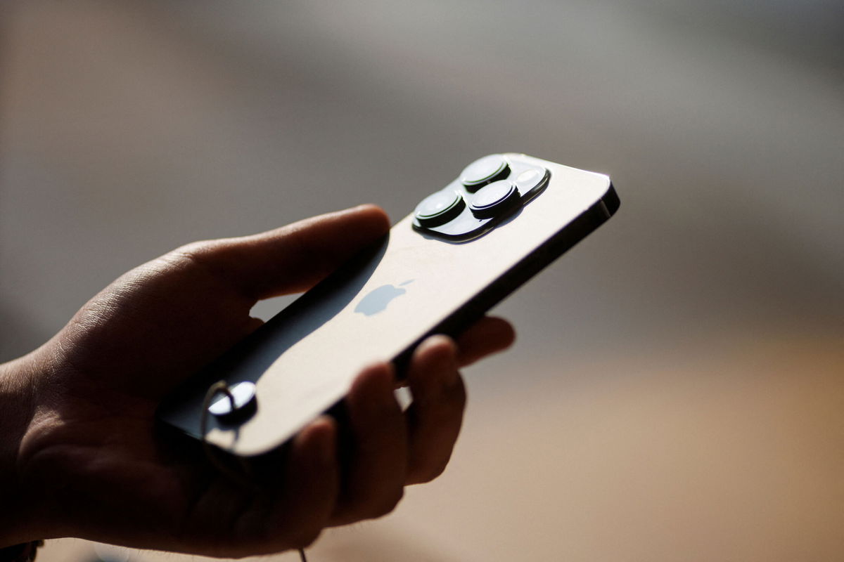 <i>Thomas Peter/Reuters</i><br/>Apple has started making its new iPhone 14 in India. A man holds an iPhone 14 as Apple Inc's new models go on sale at an Apple store in Beijing