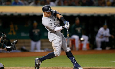 Aaron Judge of the New York Yankees hits a three-run home run against the Oakland Athletics on August 26 in Oakland