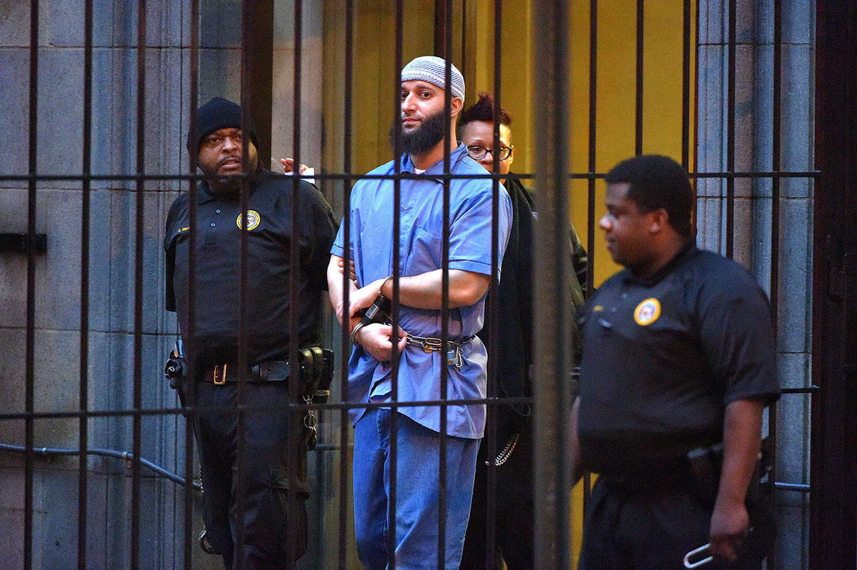<i>Karl Merton Ferron/Baltimore Sun/Tribune News Service/Getty Images</i><br/>Officials escort