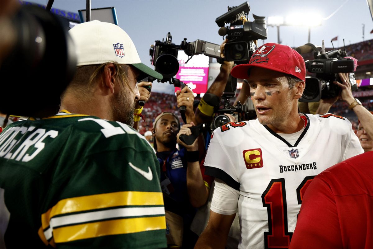 <i>Douglas P. DeFelice/Getty Images North America/Getty Images</i><br/>Aaron Rodgers (left) and Tom Brady greet each other after Sunday's game.