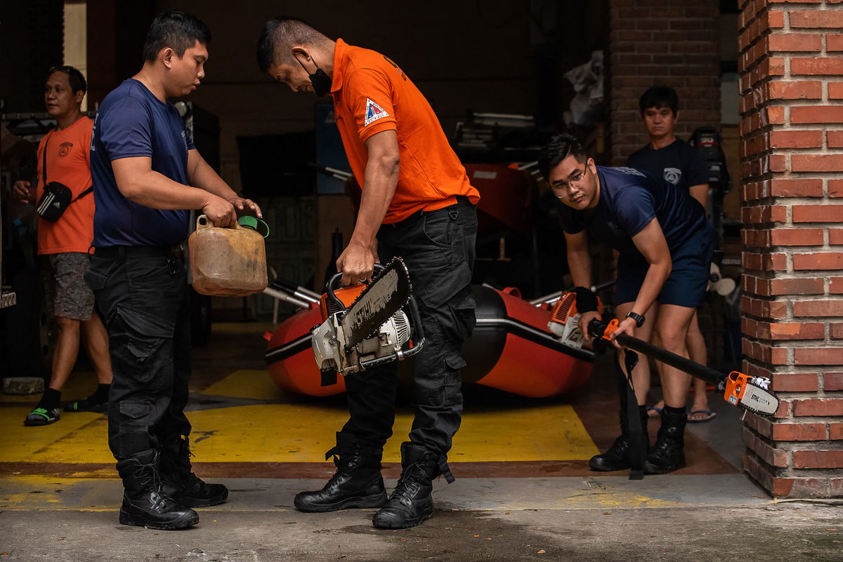 <i>Kevin Tristan Espiritu/AFP/Getty Images</i><br/>Members of the Disaster Risk Reduction and Management Office in Quezon City