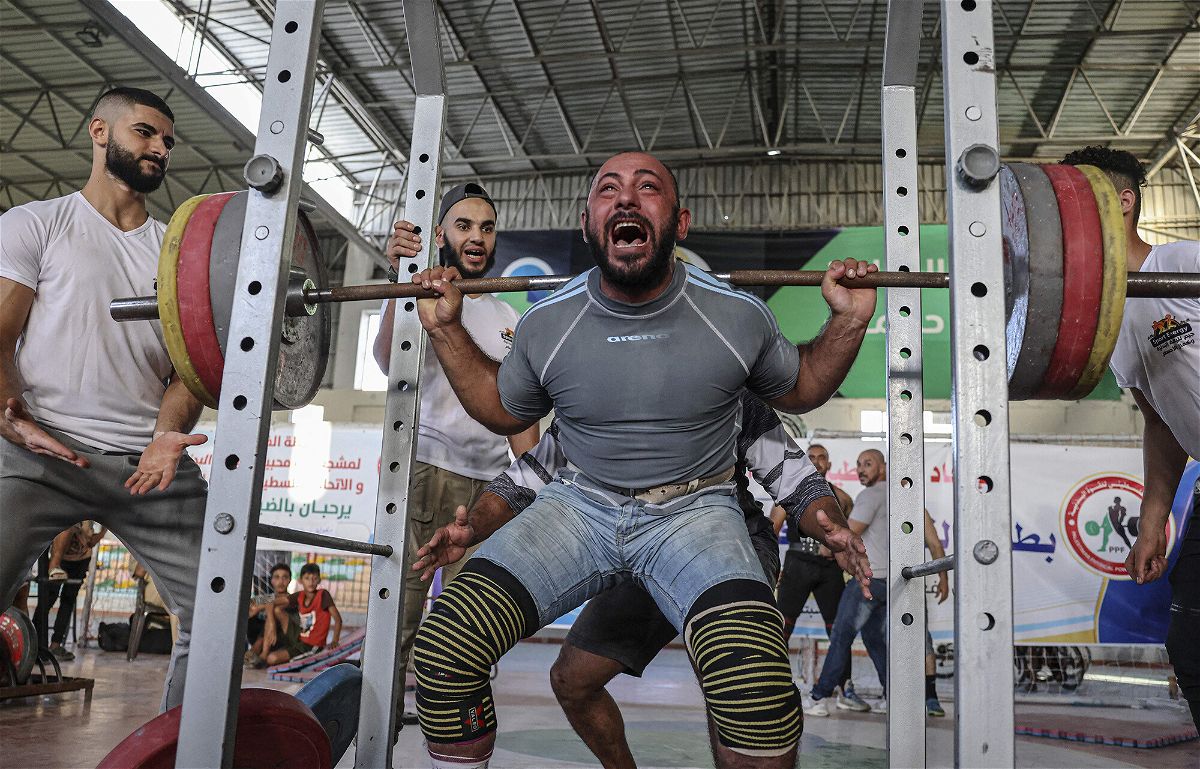 <i>Said Khatib/AFP/Getty Images</i><br/>A Palestinian takes part in a weightlifting championship in the southern Gaza Strip town of Khan Yunis on September 24.