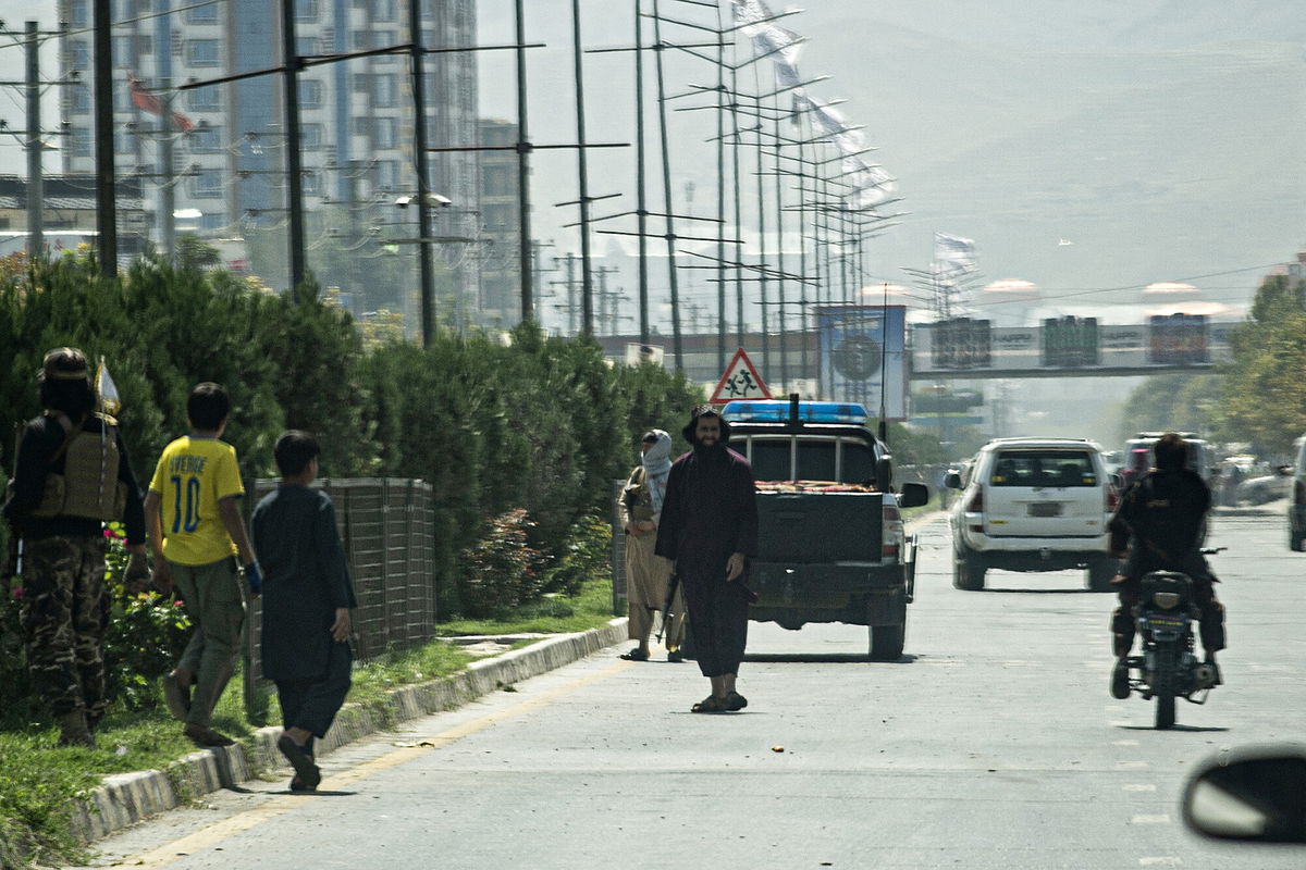 <i>Wakil Kohsar/AFP/Getty Images</i><br/>Taliban fighters (C) stand guard along a road near the Russian embassy after the attack on September 5.