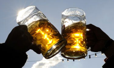 Visitors toast each other during Oktoberfest in Munich