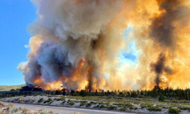 Smoke rises as the Mill Fire burns on the outskirts of Weed