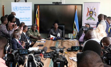 Permanent Secretary of the Ministry of Health Diana Atwine (center) confirms a case of Ebola in the country at a press conference in Kampala